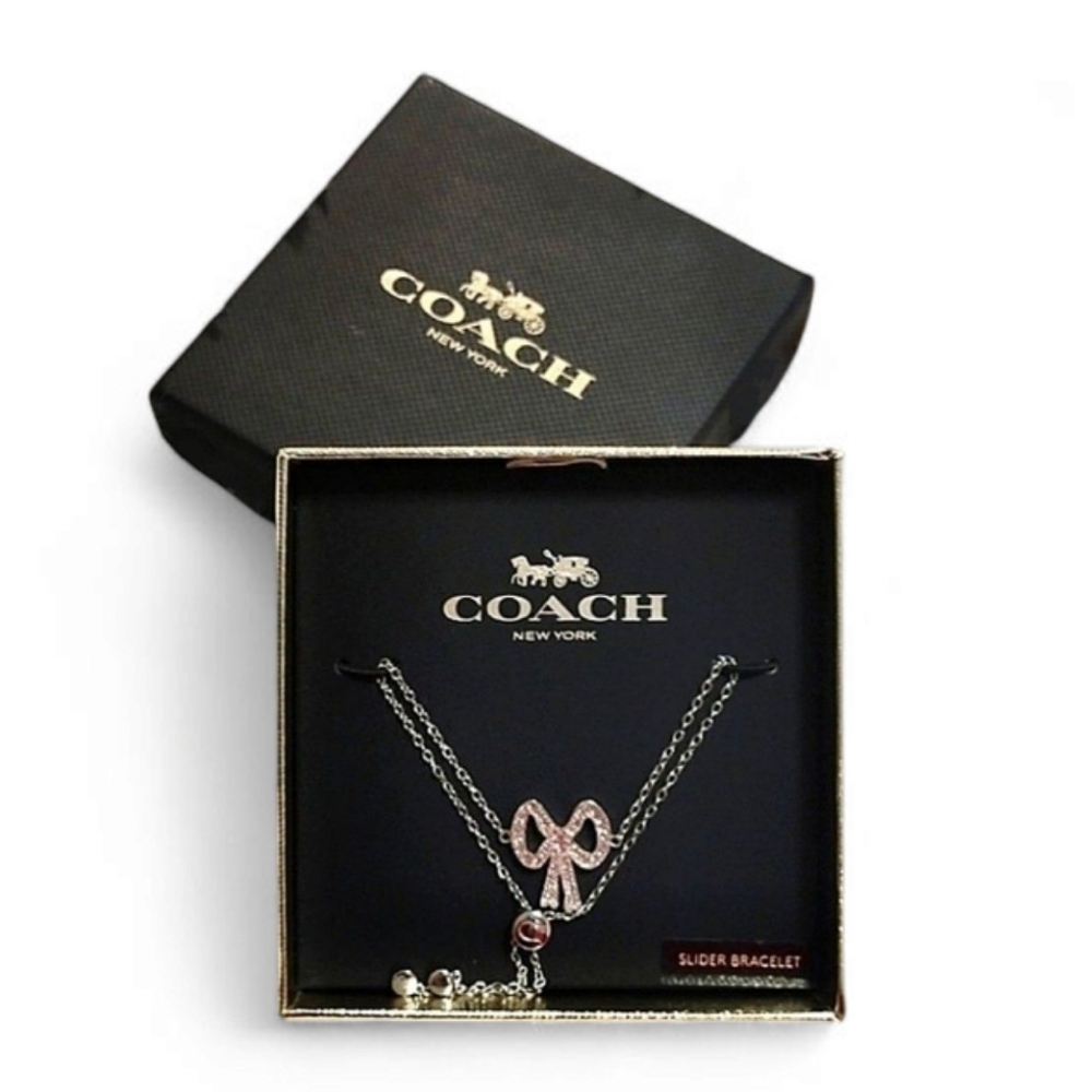 Coach Bow Tie Silver and Pink Pendant Slider Bracelet